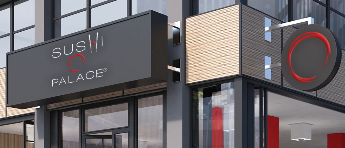 Ein modernes Gebäude mit einem Schild, auf dem "SUSHI PALACE" steht, und einem runden Logo mit einem roten Kreis.